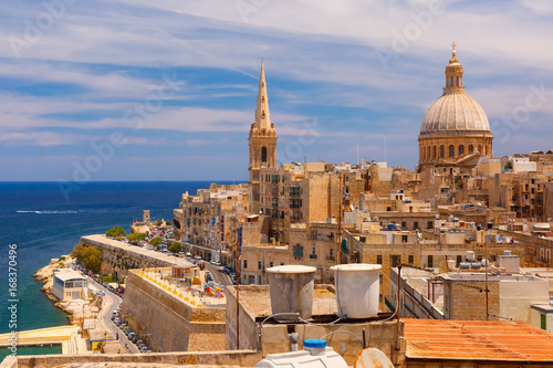 View from above of roofs and church of Our Lady of Mount Carmel and St. Paul's Anglican Pro-Cathedral, Valletta, Capital city of Malta