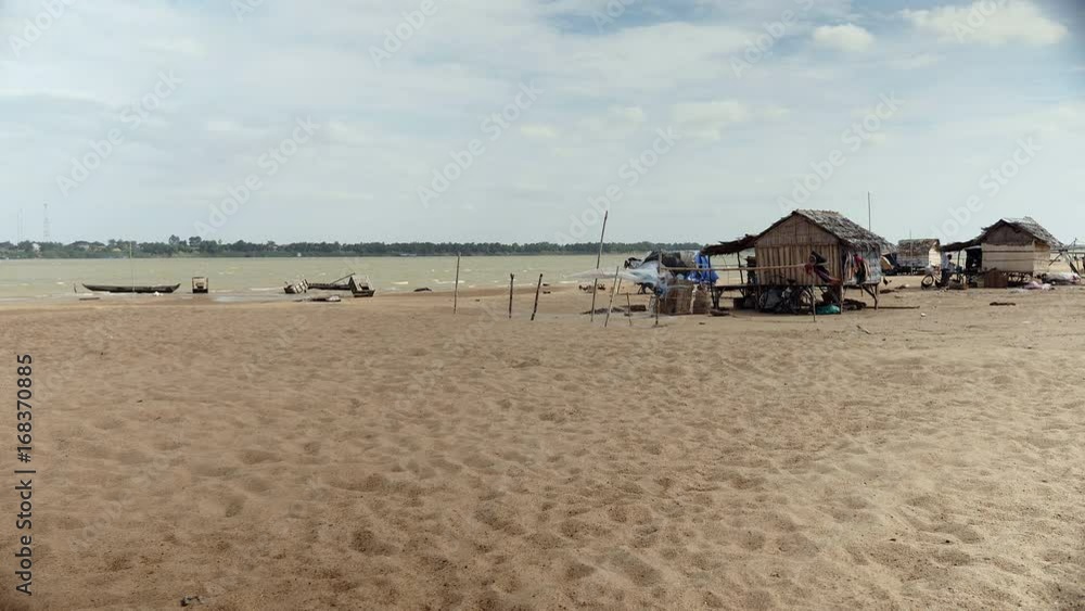 Small fishing village on the riverside on a windy day Small fishing village on the riverside on a windy day
