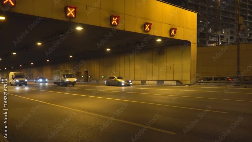 night traffic on the urban thoroughfare tunnel and road junction night traffic on the urban thoroughfare tunnel and road junction