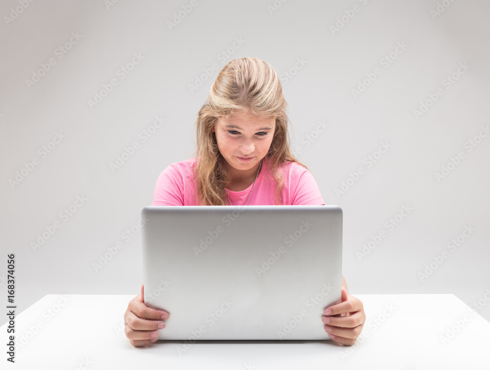 little girl being disgusted at her computer little girl being disgusted at her computer