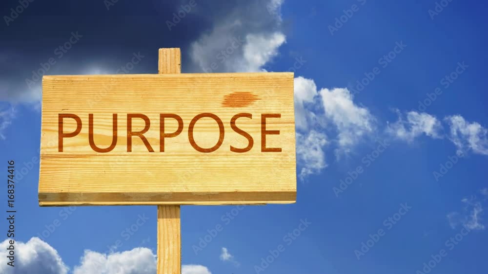 Purpose. Sign Simple Purpose word on a wooden sign against time lapse clouds in the blue sky ...