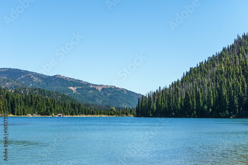 Mountain lake in mountains at sunny day British Columbia Canada.