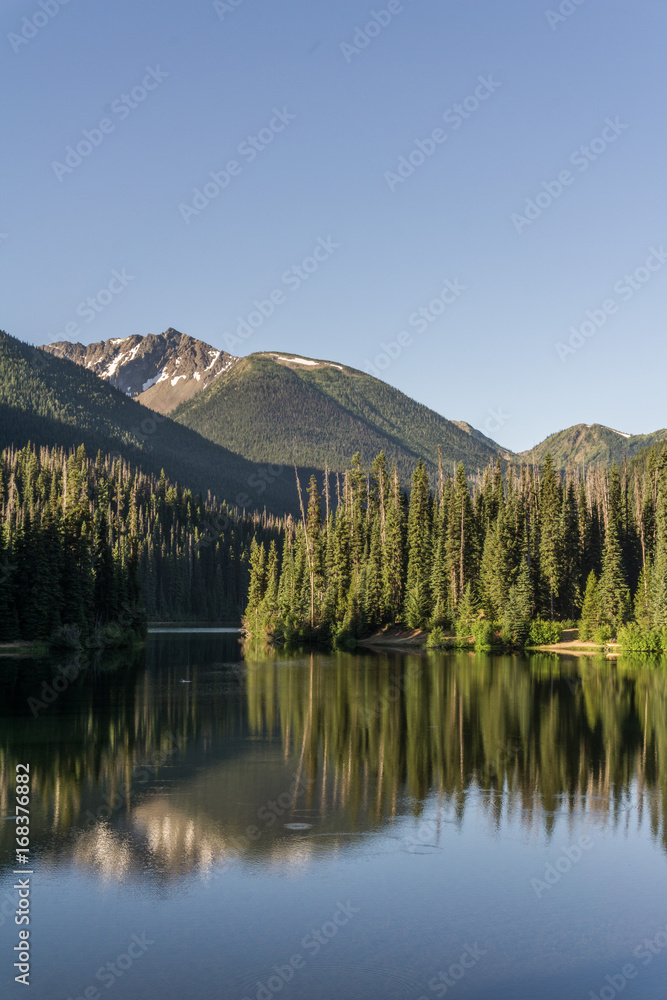 Mountain lake in mountains at sunny day British Columbia Canada.