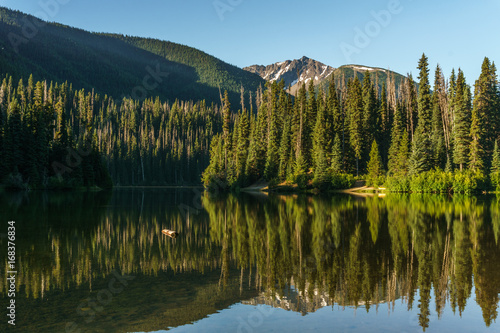 Mountain lake in mountains at sunny day British Columbia Canada.