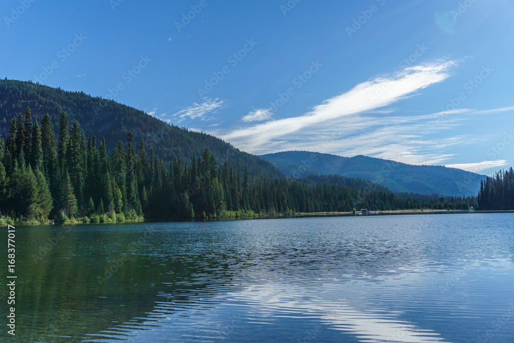Mountain lake in mountains at sunny day British Columbia Canada.