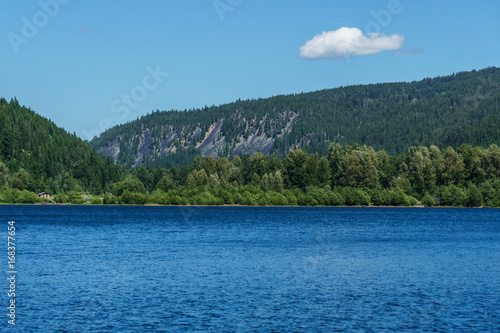 Mountain lake in mountains at sunny day British Columbia Canada.