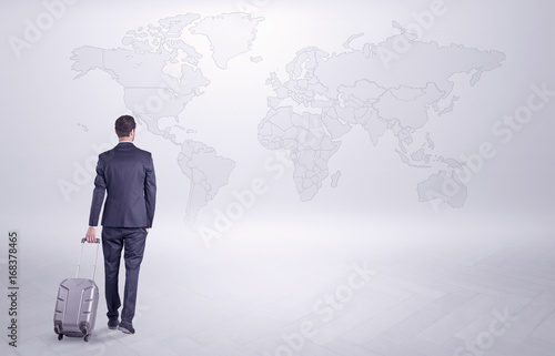 Businessman planning his trip over the world