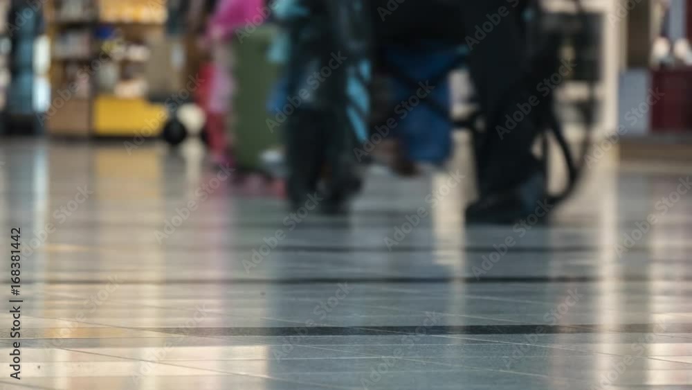 People on the airport terminal with suitcases People on the airport terminal with suitcases