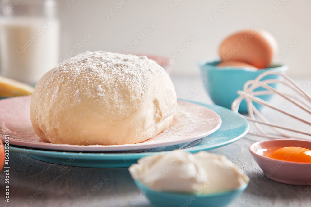 Baking ingredients and dough on wooden background Baking ingredients and dough on wooden background