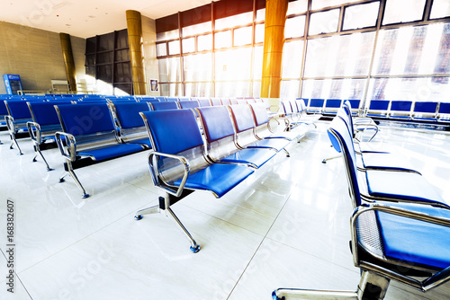 Empty airport terminal waiting area with chairs in Shanghai Hongqiao airport. photo