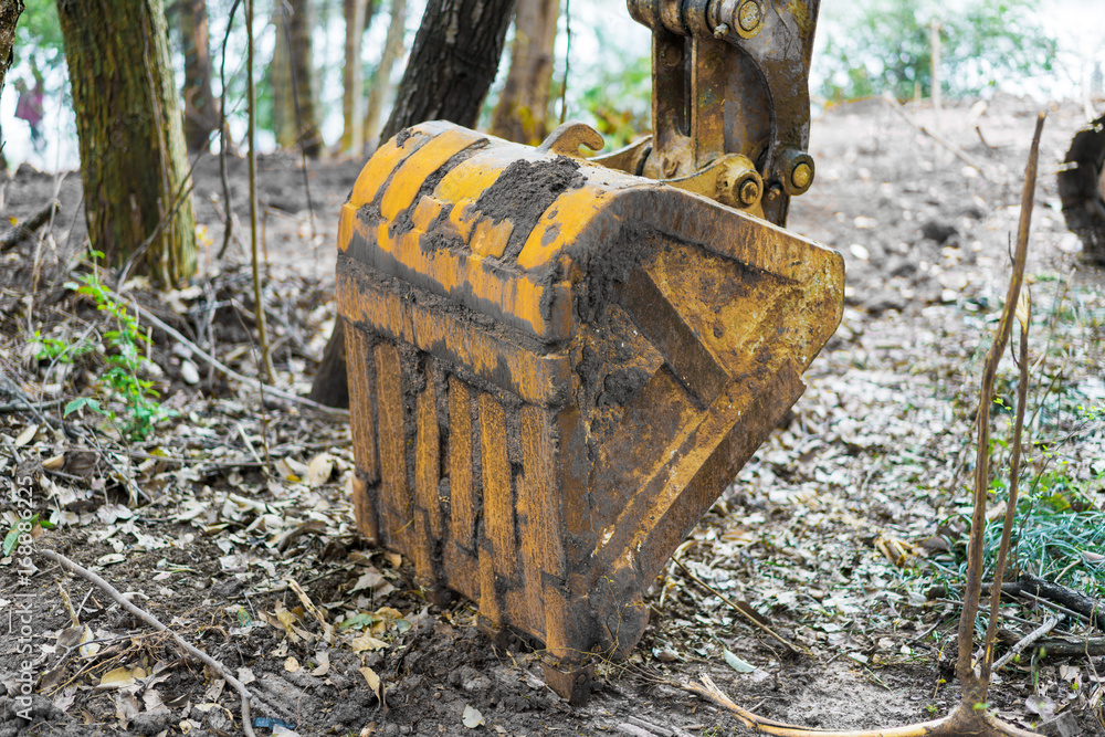 The excavator is working excavation site construction The excavator is working excavation site construction