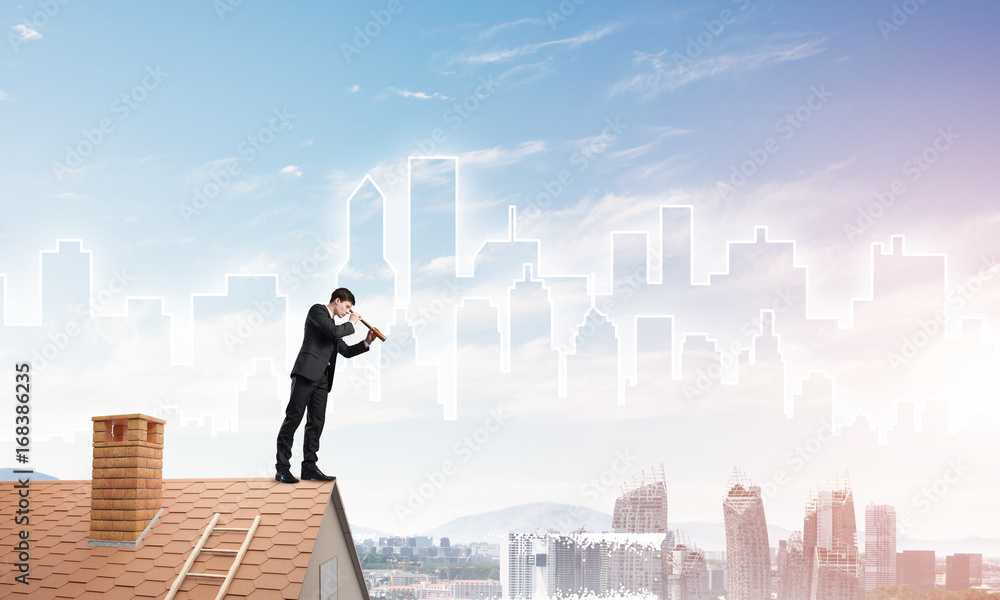 Engineer man standing on roof and looking in spyglass. Mixed media Engineer man standing on roof and looking in spyglass. Mixed media