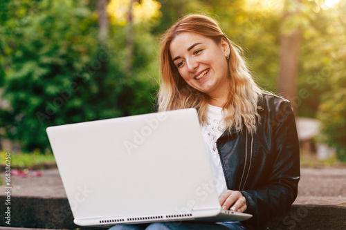 Beautiful Young Girl Working on Laptop Outside Her Office, Freelance Concept