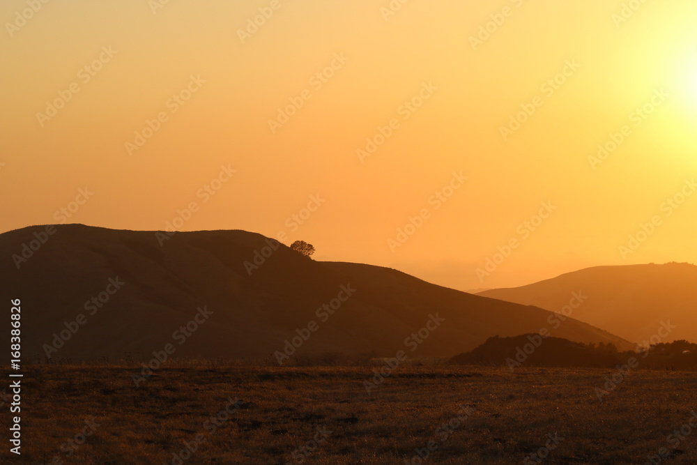 Sunset and coastal mountain 