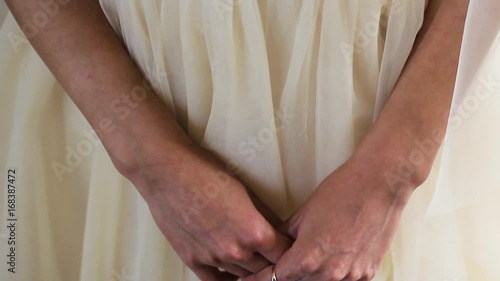 Women's Hands On The Background Of Tender Wedding Dress