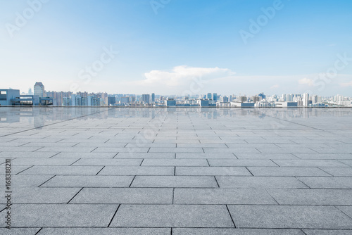 cityscape and skyline of hangzhou from empty brick floor