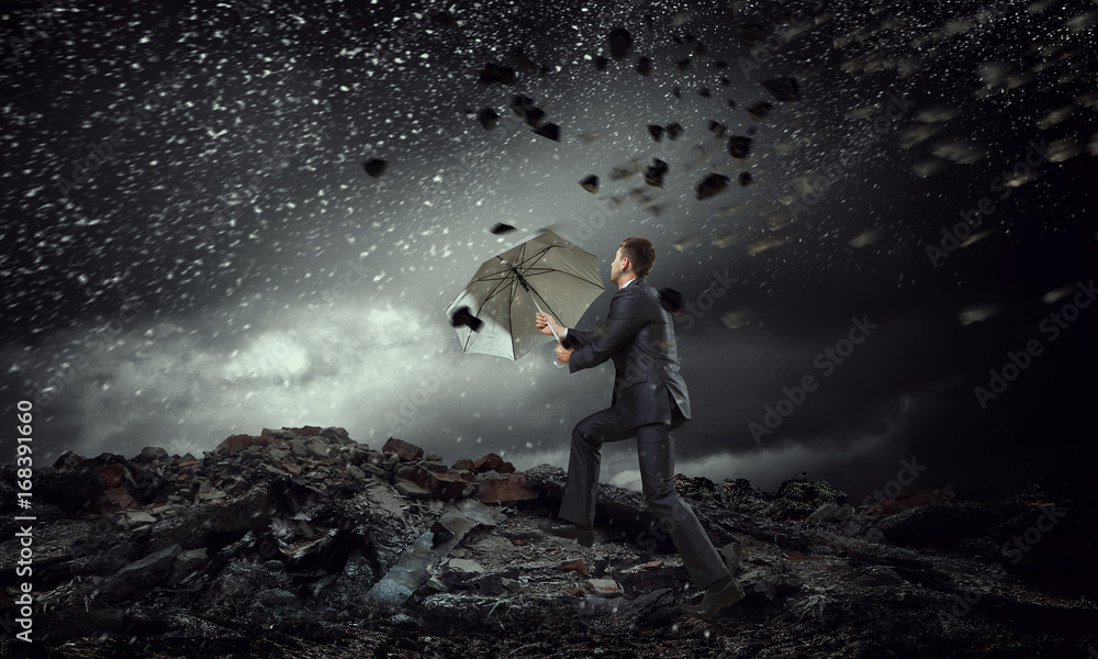 Businessman with black umbrella. Mixed media Businessman with black umbrella. Mixed media