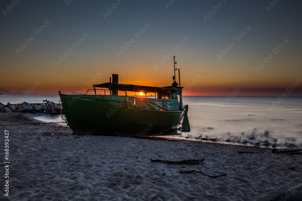 Fototapeta premium Amazing sunrise on the pier at the seaside. Gdynia Orlowo, Poland