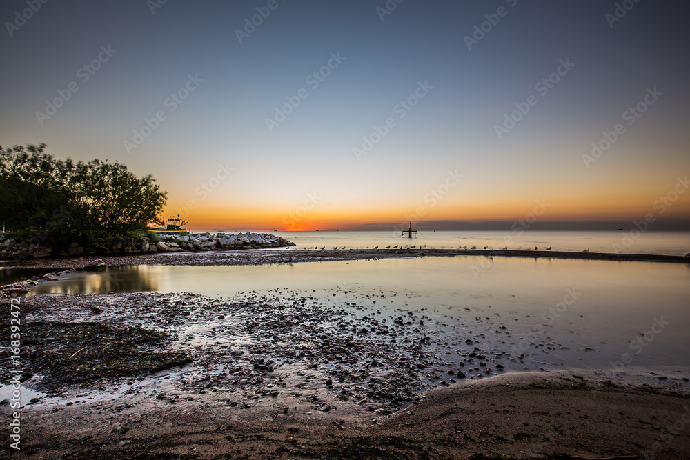 Fototapeta premium Amazing sunrise on the pier at the seaside. Gdynia Orlowo, Poland