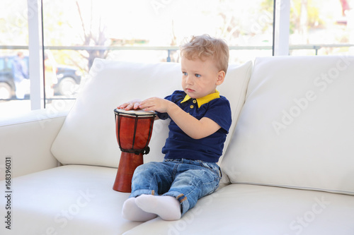 Cute little boy with drum o...