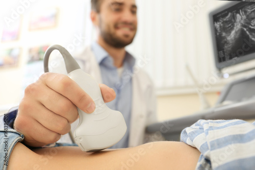 Doctor conducting ultrasoun...