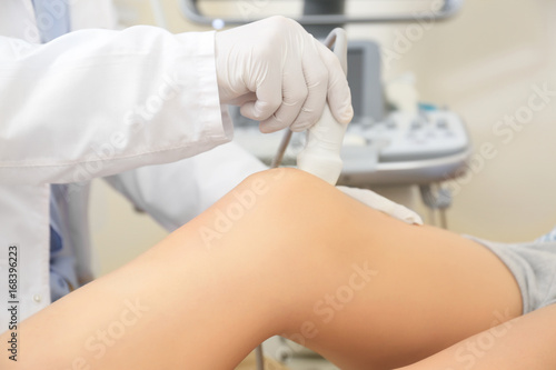 Doctor conducting ultrasoun...