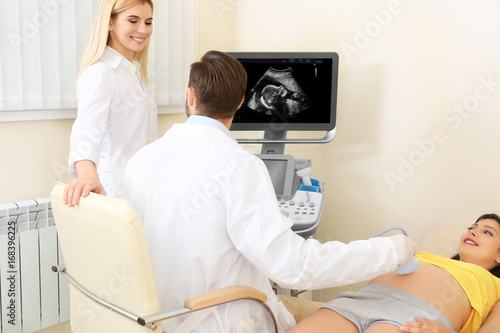 Doctors conducting ultrasou...
