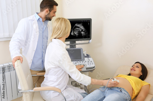 Doctors conducting ultrasou...