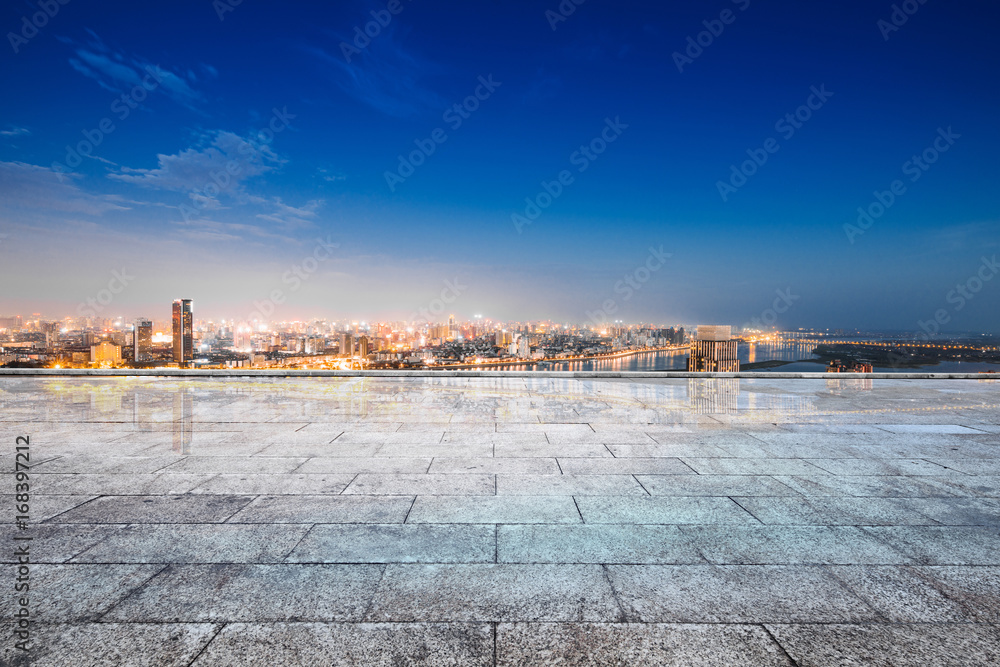 cityscape and skyline of hangzhou from empty brick floor