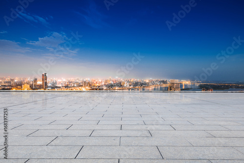 cityscape and skyline of hangzhou from empty brick floor