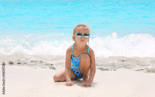 Cute little girl on sea beach