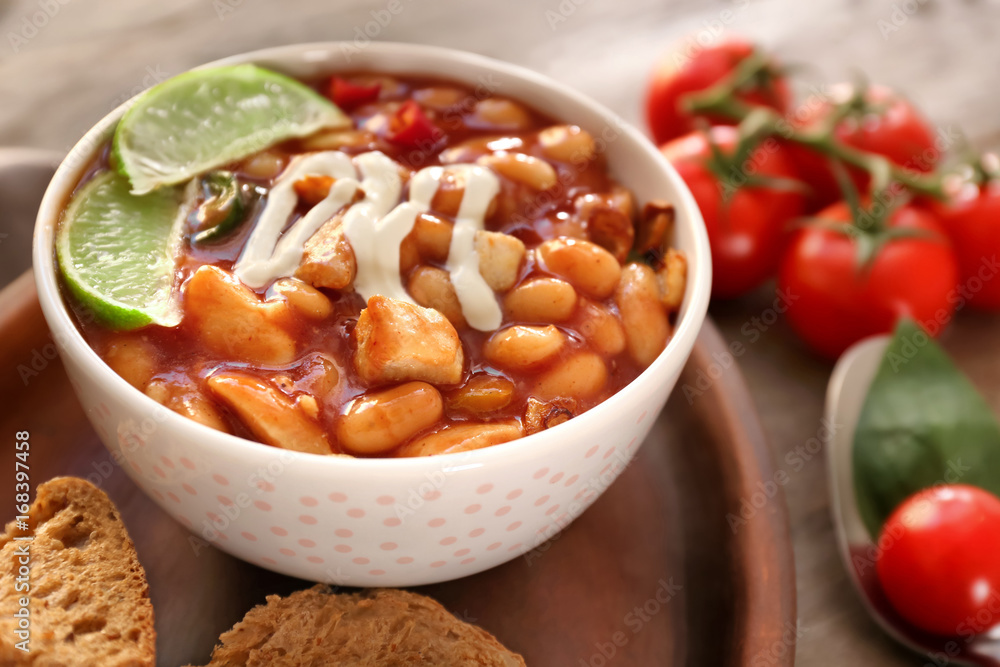 Delicious turkey chili in bowl on table Delicious turkey chili in bowl on table