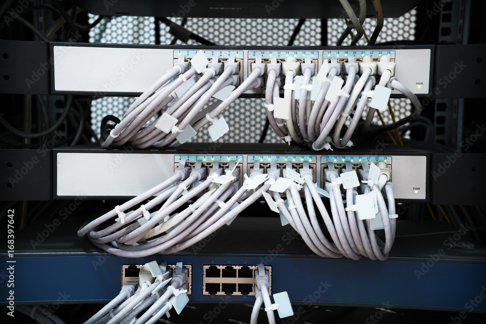Network panel, switch and cable in data center Network panel, switch and cable in data center
