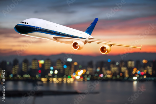 perspective view of jet airliner in flight with bokeh background photo