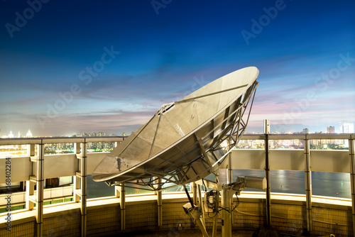 Satellite dish sky sun stars communication technology network image background for design sunset