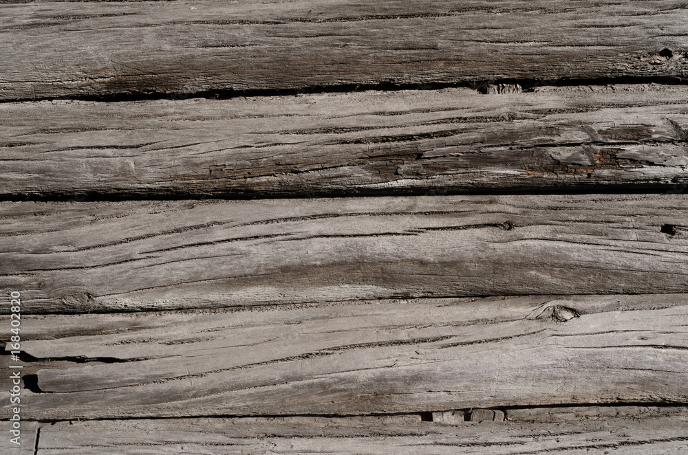 wooden boards with cracks, are located one by one wooden boards with cracks, are located one by one