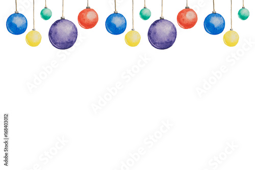Several Christmas multi-colored balls painted with watercolors hanging on threads on a white background