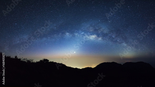 Starry night sky with high moutain at Doi Luang Chiang Dao and milky way galaxy with stars and space dust in the universe