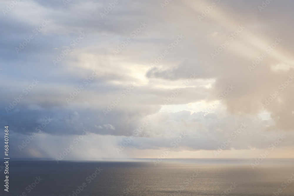 Sunlight through clouds over the Atlantic Ocean Sunlight through clouds over the Atlantic Ocean