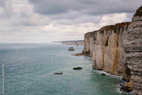 The beach and cliffs of Etretat, the Normandy tourist site of the French city photo