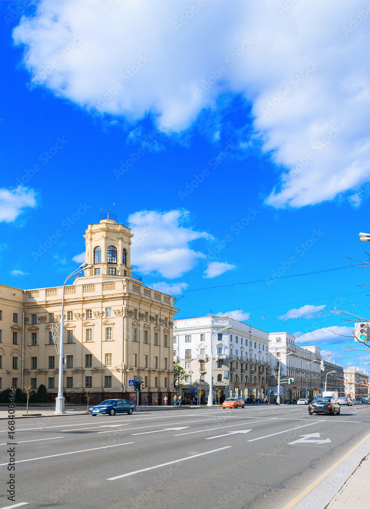 Central building kgb in Minsk, Belarus. Classical facade with columns. Blue sky with clouds. City landscape.
