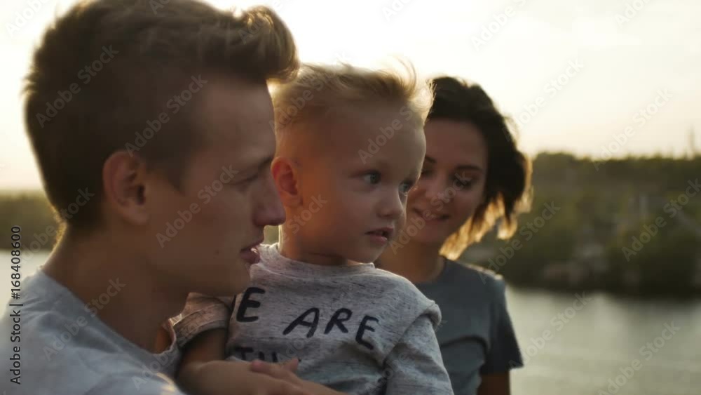 profiles fases of a young happy family with two year old son outdoors profiles fases of a young happy family with two year old son outdoors