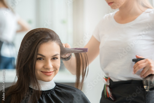  Young women sitting in beauty hair salon style