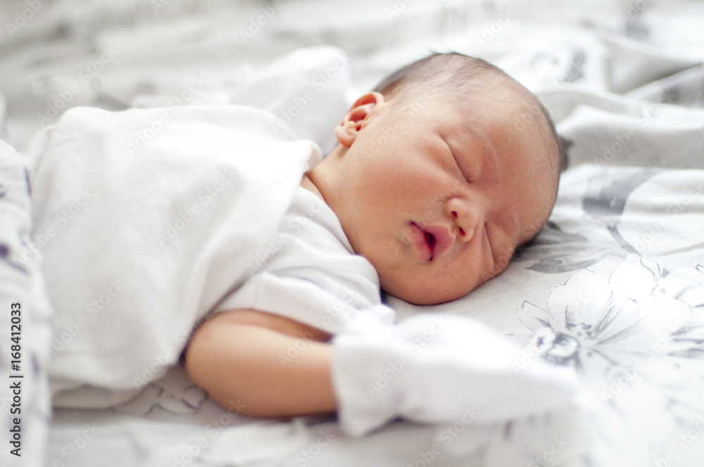 A newborn baby is sleeping A newborn baby is sleeping