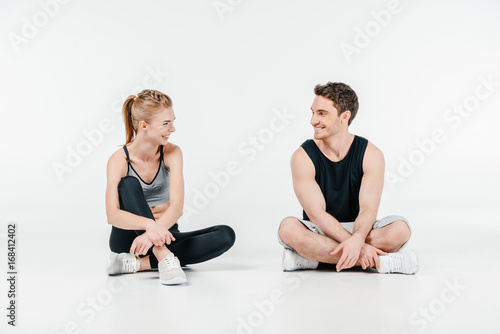 fit couple relaxing on floor