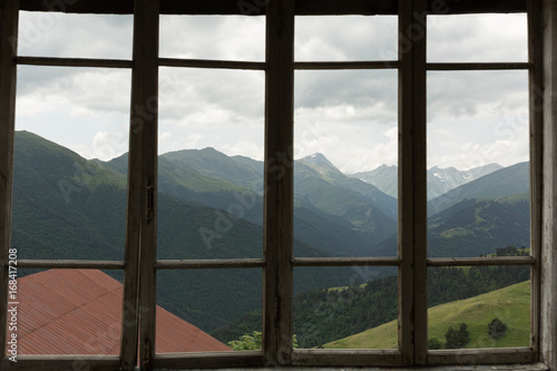 glassless windows on the veranda of an abandoned cabin in the Tusheti village of Bochorna