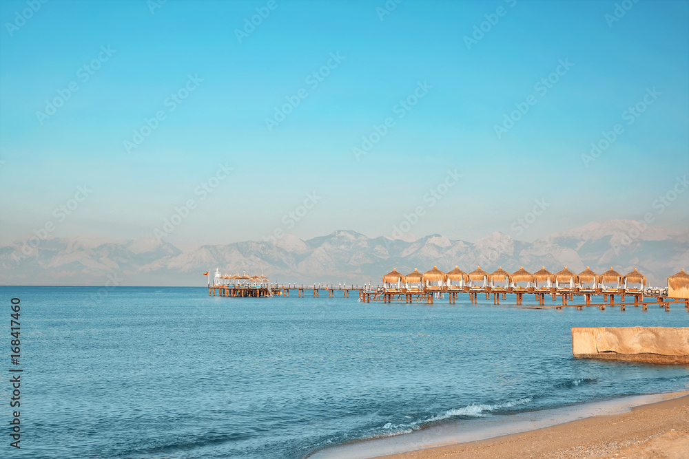 Beautiful seascape with pier on sunny day