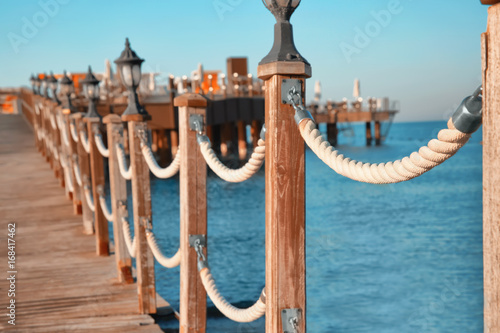 Wooden fence on pier © Africa Studio