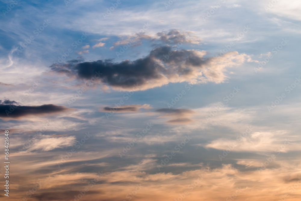 colorful dramatic sky with cloud at sunset.