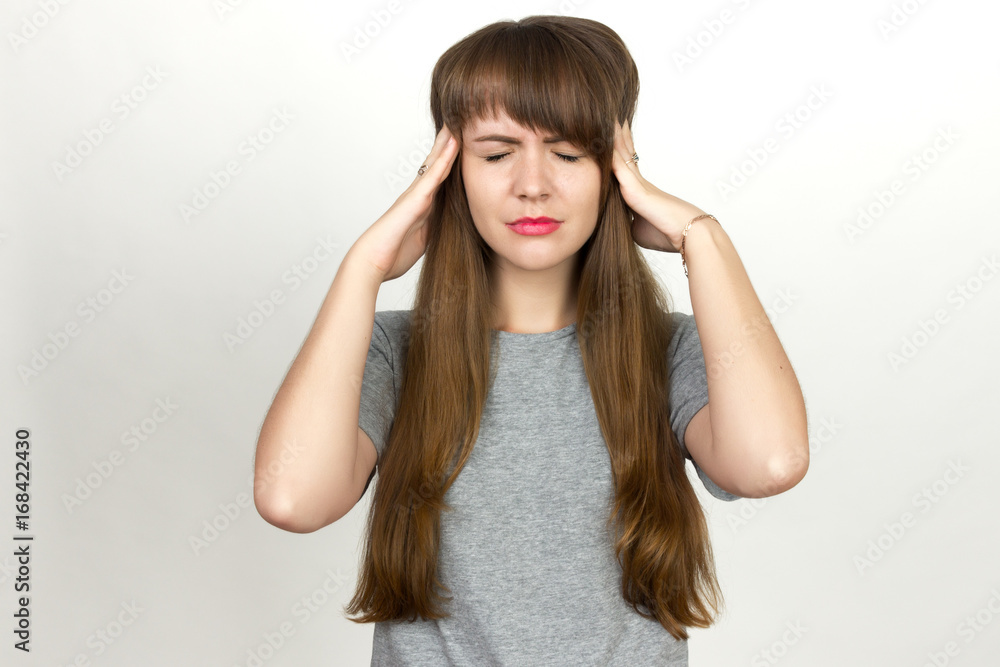 Portrait of a pretty woman stress and headache having migraine pain Portrait of a pretty woman stress and headache having migraine pain